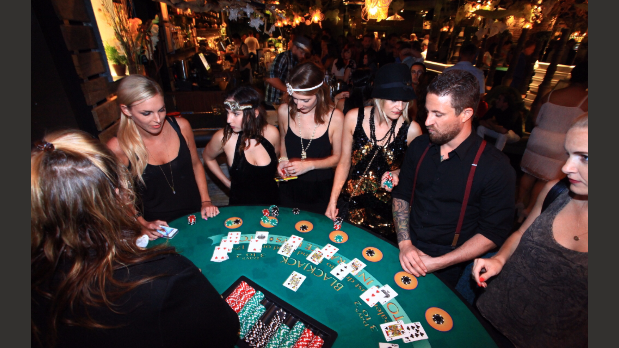 Guests playing blackjack at a casino party event
