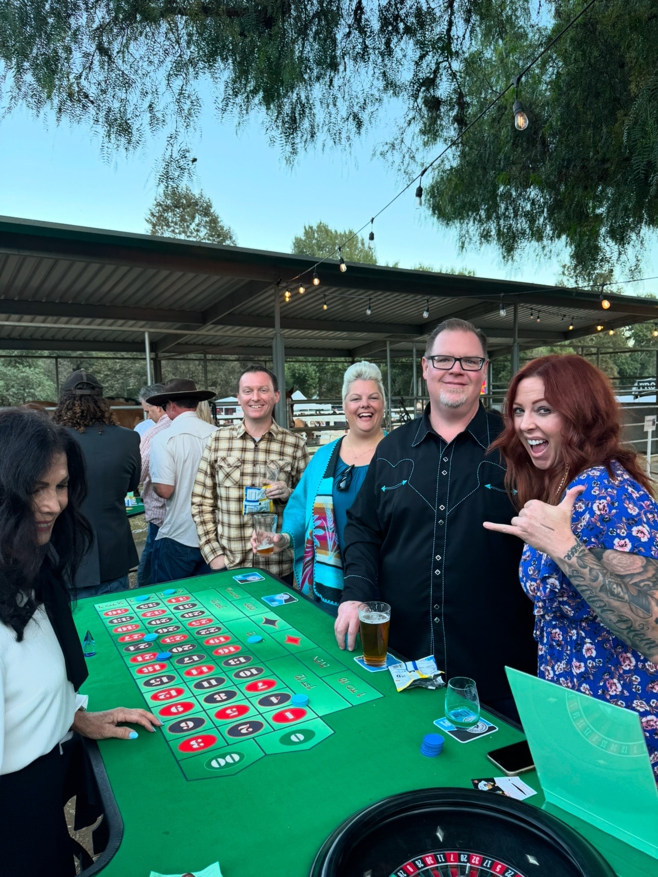 Guests playing roulette at an outdoor casino party event