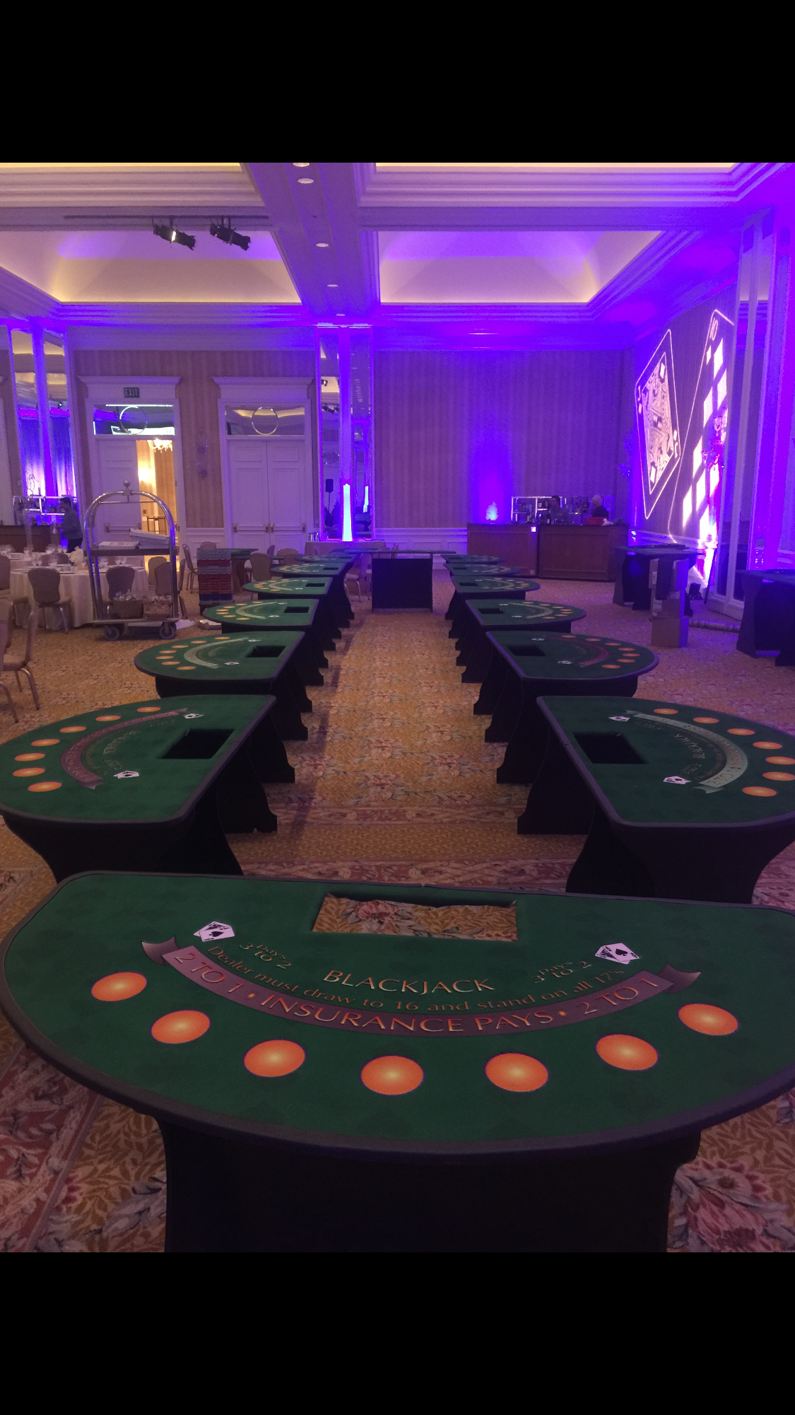 Ballroom casino setup with purple lighting