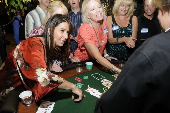 Excited crowd at blackjack table