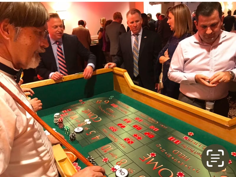 Craps table with excited guests