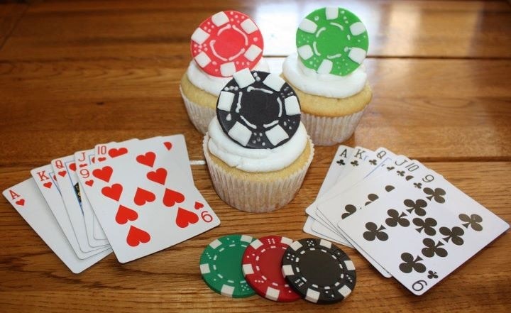 Casino-themed cupcakes and playing cards