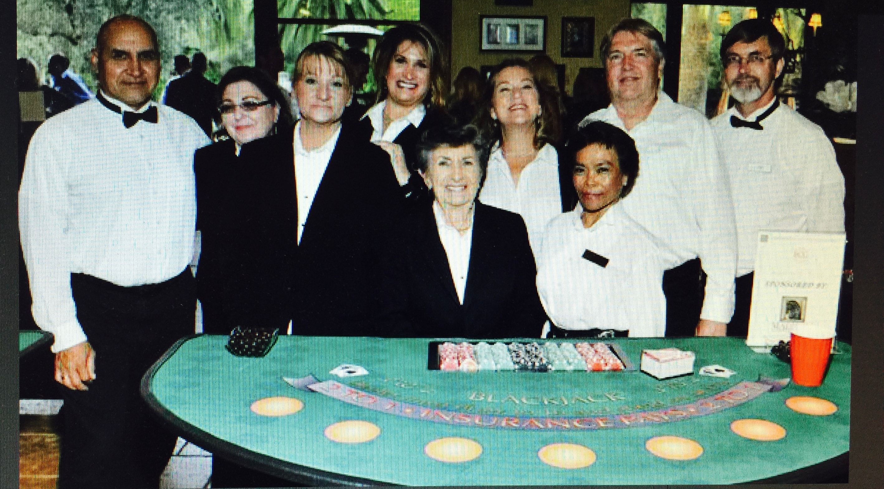 Dealer team photo at a blackjack table